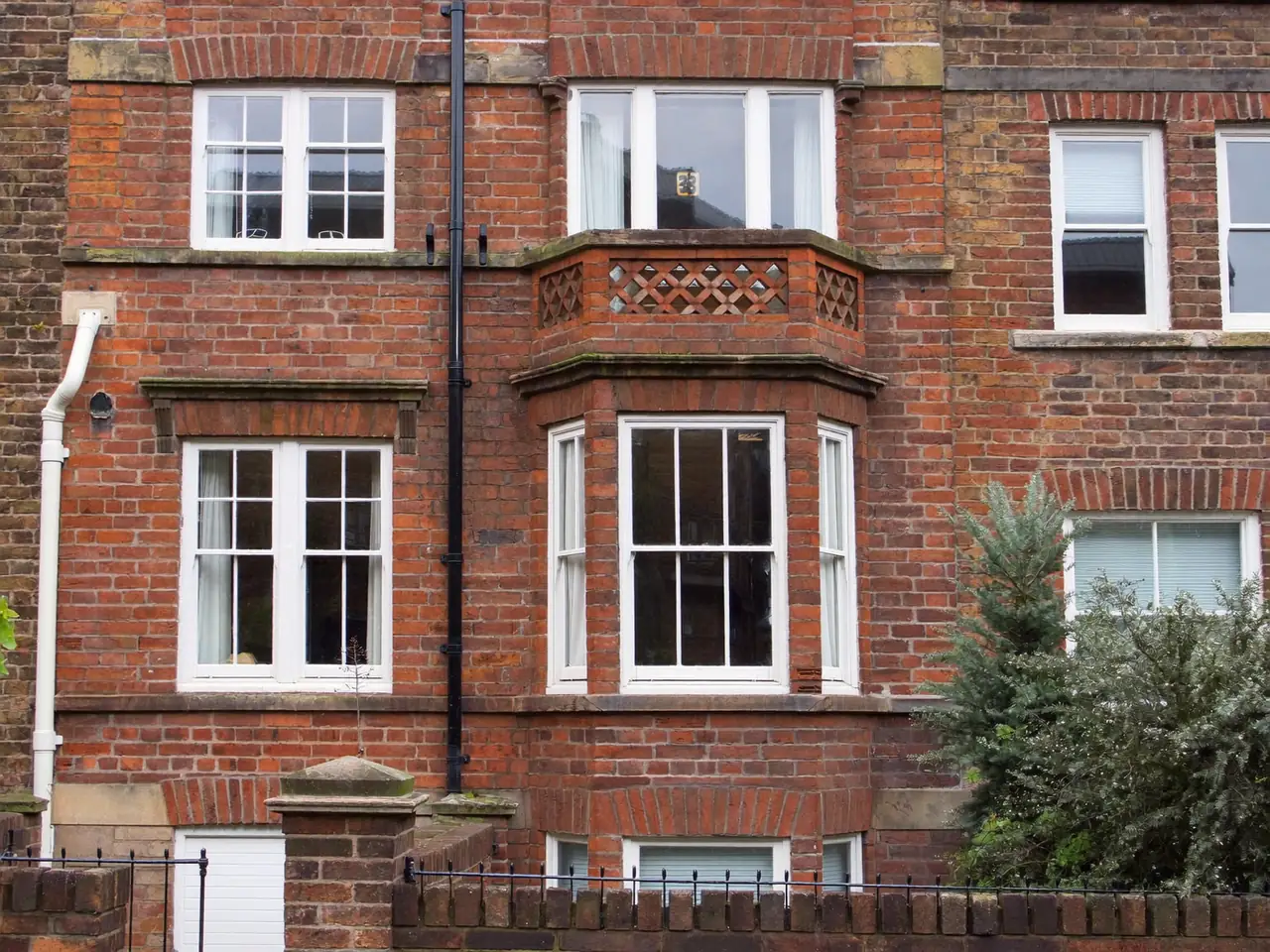 Energy-efficient double-glazed windows fitted to a UK brick terraced house