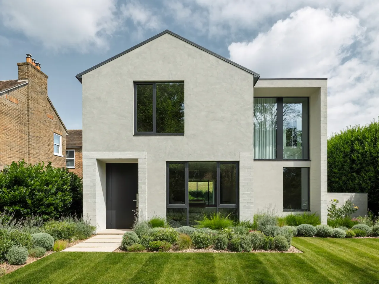 Modern UK home with large energy-efficient windows across the front elevation