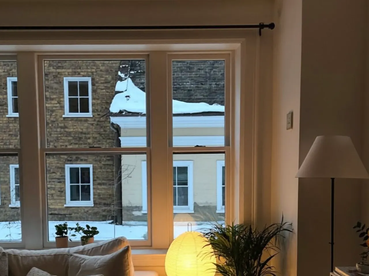 Sunlight passing through Low-E coated glass into a bright, warm living room